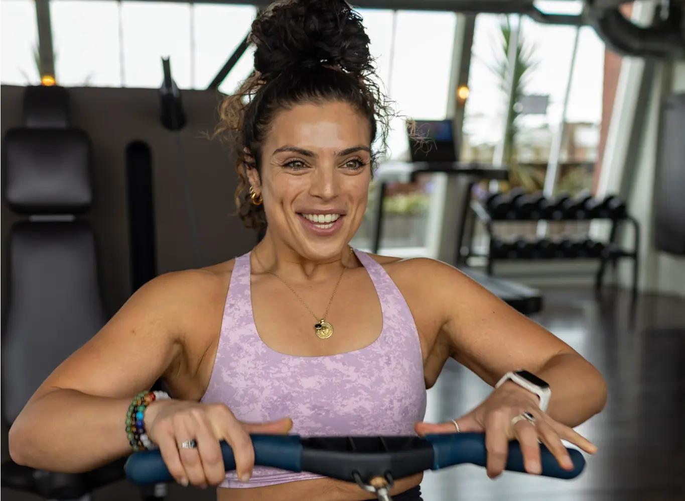 Personal trainer coaching barbell technique